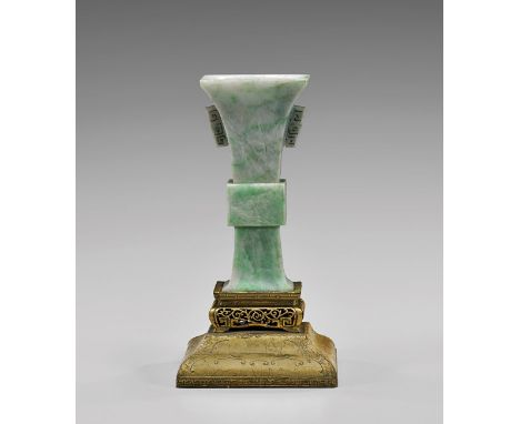 ANTIQUE CARVED JADEITE BEAKER VASEAntique Chinese carved jadeite vase; of squared, beaker form, with archaistic incised desig