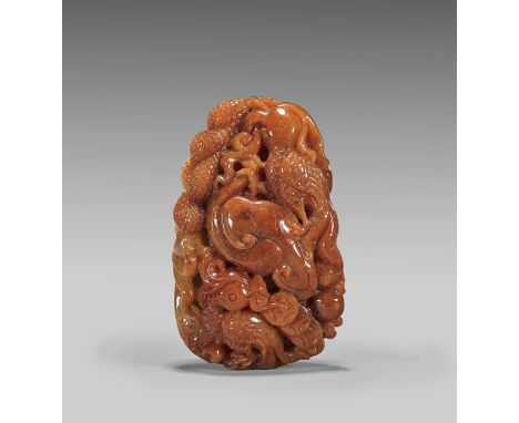 CHINESE CARVED RED JADEITE TOGGLE: ParrotsChinese carved red jadeite toggle; with design of two parrots amid fungus and spray