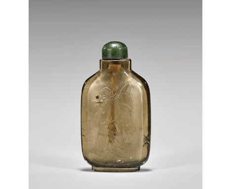 ANTIQUE SMOKEY QUARTZ SNUFF BOTTLEFinely hollowed and antique, Chinese carved smokey quartz crystal snuff bottle; of tall fla
