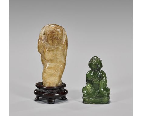 TWO ANTIQUE CHINESE FIGURAL JADE TOGGLESTwo small and antique, Chinese carved figural jade toggles: pebble-form, white and ta