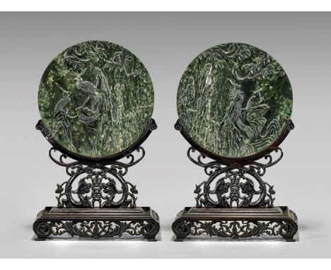 PAIR CARVED SPINACH JADE PLAQUES/TABLESCREENSPair of Chinese carved spinach jade plaques; each of circular form, the front sh