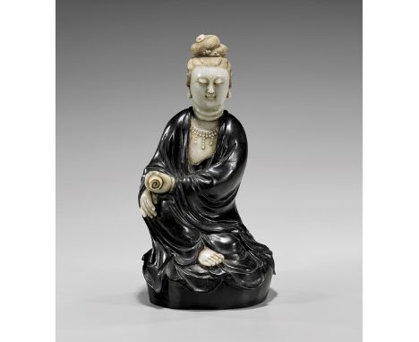 CARVED JADE & ZITAN WOOD GUANYINChinese carved jade and Zitan wood figure; of Guanyin seated in position of "Royal Ease", hol