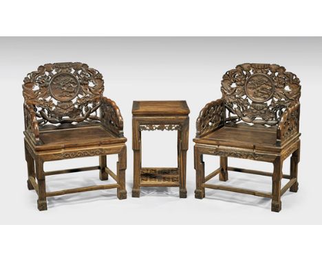 SET CHINESE CARVED WOOD CHAIRS & TABLEChinese carved tielimu (ceylon ironwood) set of two armchairs and side table: the finel