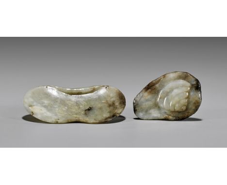TWO ANTIQUE CELADON JADE LOTUS CARVINGSTwo antique Chinese celadon jade lotus carvings: smaller toggle of a lotus pad carryin