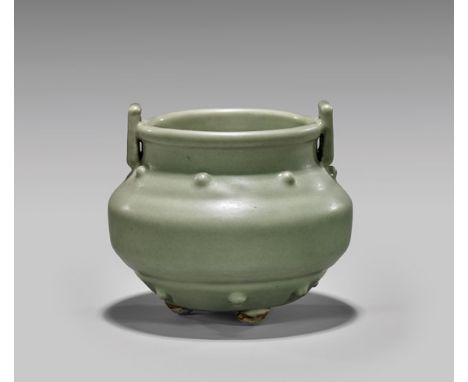 ANTIQUE CELADON GLAZED TRIPOD CENSERAntique Chinese celadon glazed tripod censer; with two rows of raised prunts and two shor