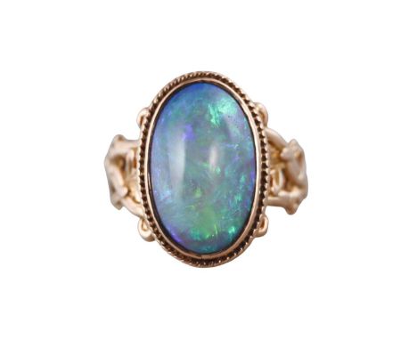  Metal  : 14k Gold   Designer  : Not Signed   Gemstone  : Opal approx. 4ct.    Measurements  : Ring size 7.5, top is 18mm x 1
