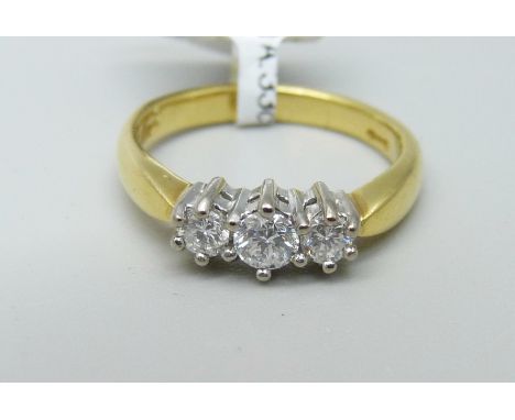 An 18ct yellow gold three stone diamond ring, 3.8g, J 