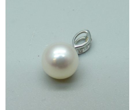 An 18ct white gold, diamond and pearl pendant 