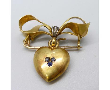 An antique 15ct gold, diamond and sapphire set heart shaped brooch, 4.3g 