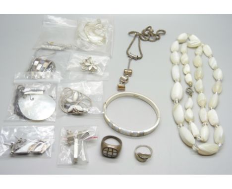 A collection of silver and silver mounted mother of pearl jewellery 