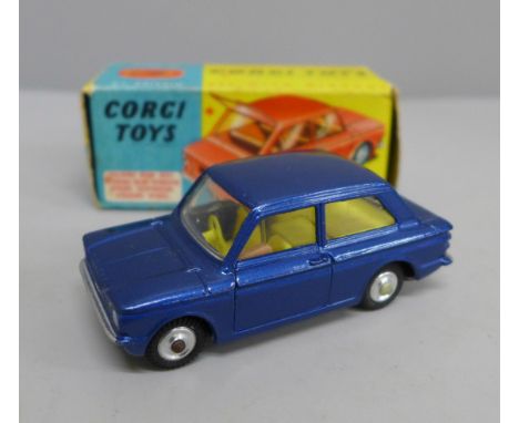 A Corgi Toys no.251 Hillman Imp, blue body with yellow interior, in original box with operating instructions and folding rear