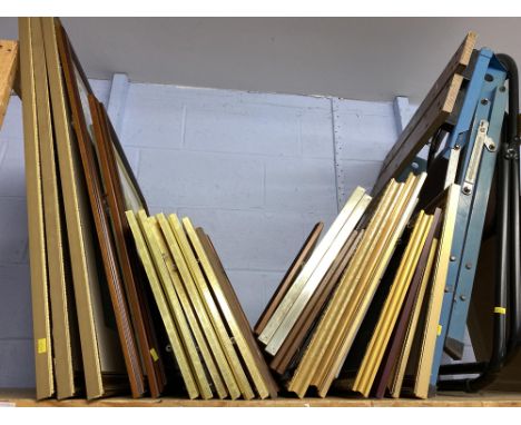 Shelf of mixed artwork