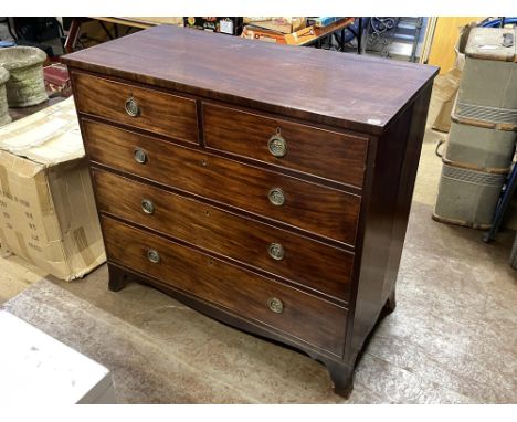 A Georgian mahogany straight front chest of two short and three long graduated drawers, supported on splayed bracket feet