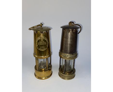 A brass cased Miner's lamp, 'The Protector Lamp and Lighting Co. Ltd', Type 6 and another