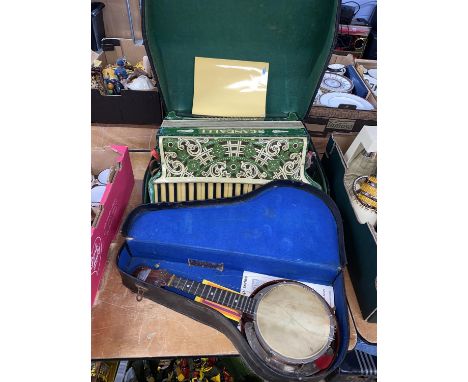 A George Formby Ukulele and a cased Scandalli accordion