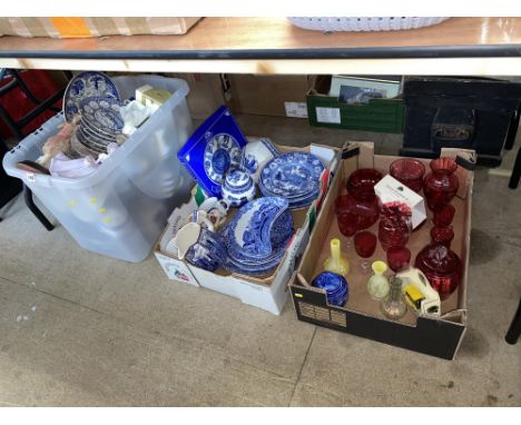 A box of cranberry glassware and two boxes of Ringtons china