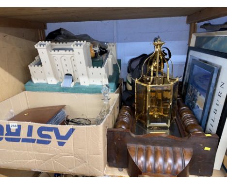 Shelf containing pictures, clock, glassware, a toy play fort, Nikon lense, 1st Day covers, Beswick horse, Fish knives and for