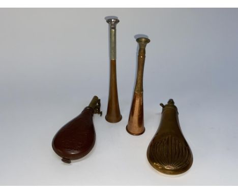 A copper powder flask, embossed with fanned palm leaves and measuring 20cm L, another powder flask and two copper hunting hor