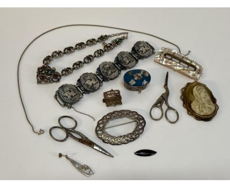 A bag of white and yellow metal jewellery, to include a Virgin Mary shell cameo brooch, sewing scissors and an Aztec design b