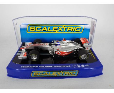 Scalextric - Vodafone McLaren Mercedes Formula One car number 3 driven by Jensen Button. # C3265. The car appears Mint in a V