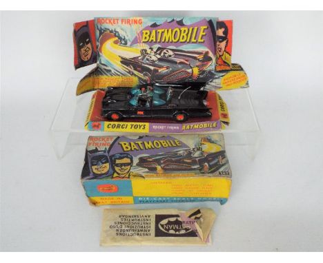 Corgi Toys - A boxed Corgi Toys 1st issue #267 Batmobile. The model with gloss black body, orange 'Bat' logo on doors, with g