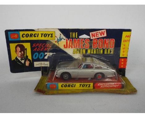 Corgi Toys - A boxed Corgi Toys #270 James Bond Aston Martin DB5 in the rarer pictorial wing flap bubble pack!! The model in 