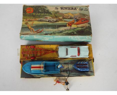 Corgi Toys - A boxed Corgi Toys Gift Set #31 'The Riviera Set'. The set contains a Buick Riviera in pale blue with red interi