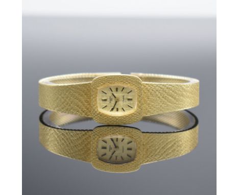 ANKER 85 Damenarmbanduhr in GG 585/000,  Handaufzug, Schweiz um 1970, Boden aufgedr., gold. Strukturzifferbl. m. aufgel. Indi
