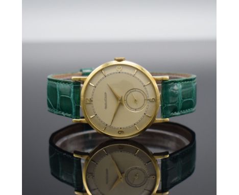 Jaeger-LeCoultre elegante Herrenarmbanduhr in GG 750/000,  Schweiz um 1950, Handaufzug, 2- tlg. Geh., Boden aufgedr., silb. D