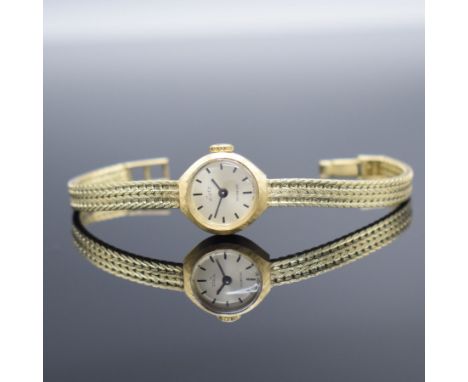LUTZ Damenarmbanduhr in GG 585/000,  Schweiz um 1965, Handaufzug, Boden aufgedr., Goldband in 585/000, silb. Zifferbl. m. sch