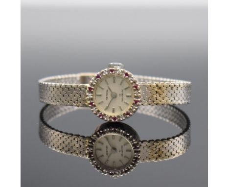 METEOR Damenarmbanduhr in WG 750/000,  Handaufzug, Schweiz um 1965, Boden aufgedr., Lünette m. Steinbesatz, silb. Zifferbl. m