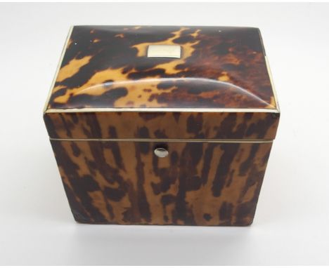 A REGENCY TORTOISESHELL TEA CADDY of rectangular form, with hinged lid with single lidded compartment, areas of wear and miss