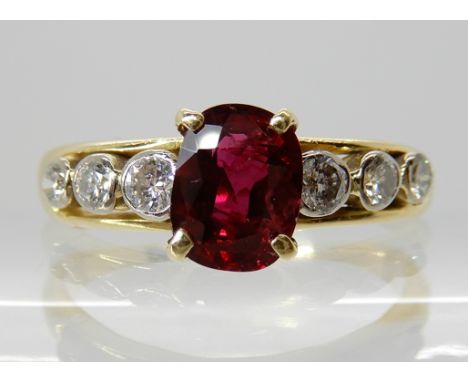 A BRIGHT YELLOW METAL RUBY AND DIAMOND RING ruby approx 7.1mm x 5.5mm x 2.9mm, diamond content estimated approx 0.15cts. Fing