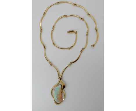 AN 18CT GOLD FANTASY CUT OPAL NECKLACE custom made for the client. opal is approximately 25mm x 11.5mm x 6mm, length of chain