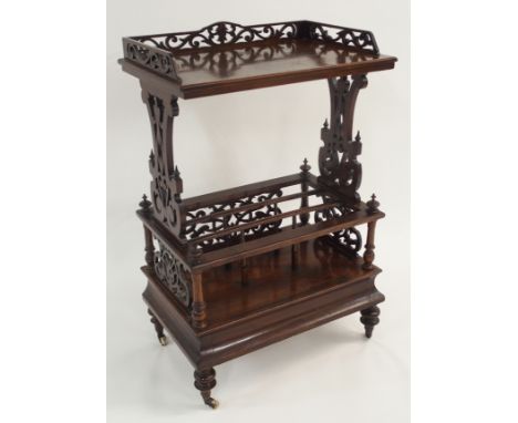 A VICTORIAN WALNUT WHAT NOT CANTERBURY with three quarter pierced gallery shelf above three divisions, 91cm high x 58cm wide 