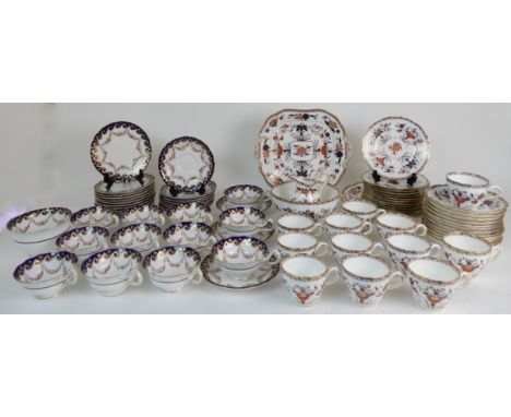 A MINTON IMARI PATTERN TEASET comprising two cake plates, twelve cups, saucers and plates, milk jug and slop bowl, pattern no