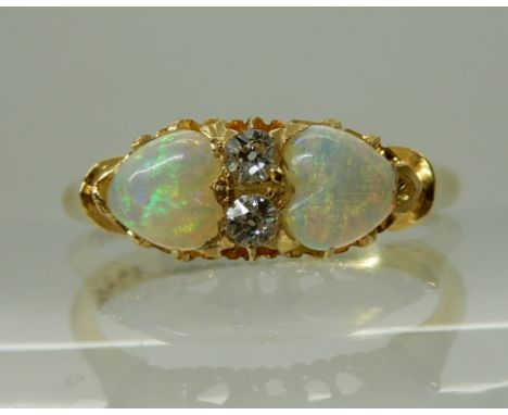 AN 18CT GOLD OPAL HEARTS AND DIAMOND RING dated Birmingham, 1899 - 1900, opals approx 5mm, diamonds estimated approx 0.03cts 