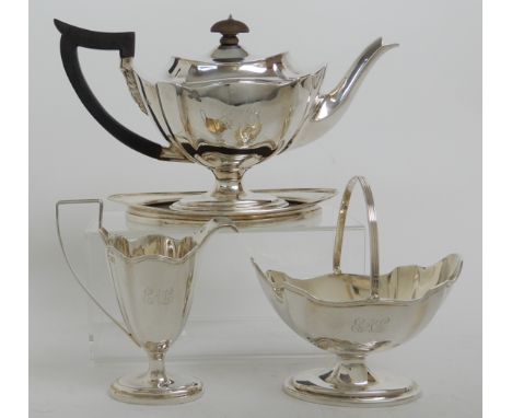 A LATE VICTORIAN FOUR PIECE SILVER TEA SERVICE by Thomas Bradsbury &amp; Sons, London 1897 comprising; pedestal teapot, silve