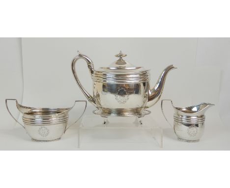 A GEORGE III SILVER FOUR PIECE TEA SERVICE maker's marks JD, Edinburgh 1802, comprising teapot with stand, cream jug and suga