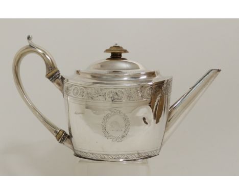 A GEORGE III SILVER TEAPOT by Thomas Wallis II, London 1798, of oval form with band of roundel and foliate engraving with twi