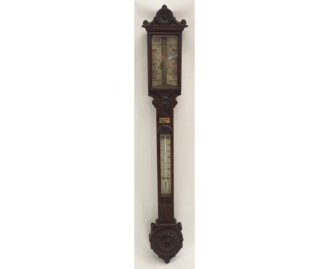 A VICTORIAN CARVED MAHOGANY BAROMETER/THERMOMETER by J White, Glasgow, retailed by W J Hassard, Optician, Glasgow, 107cm high