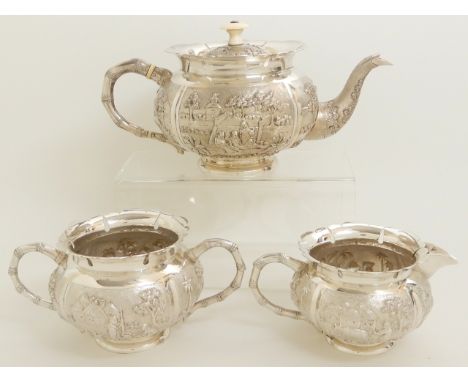 AN ASIAN, PROBABLY BURMESE THREE PIECE EXPORT SILVER TEA SERVICE (unmarked but tested silver) of bulbous form with pierced an