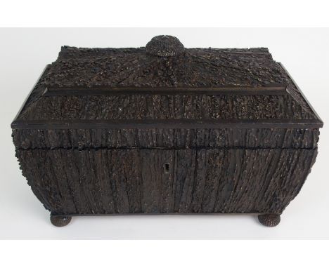 AN ANGLO-INDIAN VIZAGAPATAM ELK ANTLER TEA CADDY the sarcophagus shape with hinged cover enclosing three divisions, with foli