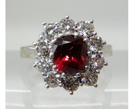 AN 18CT WHITE GOLD AND PLATINUM RUBY AND DIAMOND CLUSTER RING the central ruby measures approx 6.2mm x 5.5mm x 4.2mm, in mult