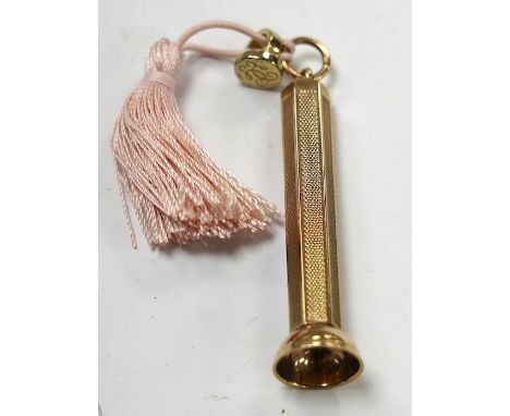 A modern engine turned 9ct gold cigar piercer, overall 67mm, gross weight 15.8 grams. Condition - fair