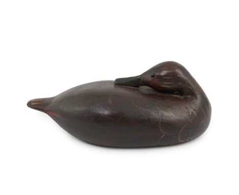 Manner of Guy Taplin (British, b.1939), a carved and painted oak model of a duck with glass inset eyes, 27cm long Condition -