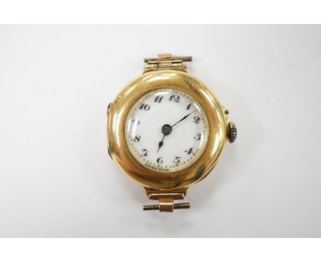 A lady's 18k manual wind wrist watch, with Arabic dial, no strap, gross weight 17.1 grams, Condition - poor