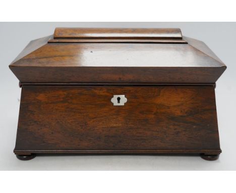 A Victorian rosewood sarcophagus shaped tea caddy with mother of pearl escutcheon, 33.5cm wide. Condition - fair, some intern