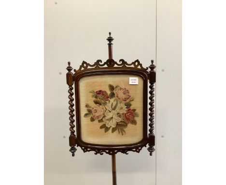 A pair of Victorian rosewood pole screens with floral tapestry banners, height 150cm. Condition - fair