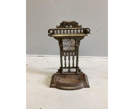 A Victorian steel stick stand with tile inset back, width 44cm, height 71cm. Condition - fair